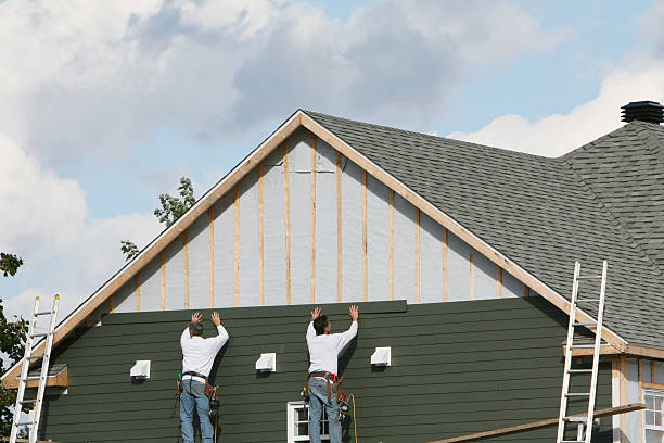 Professional Storm Damage Siding Repair technician working in Timberlake, VA